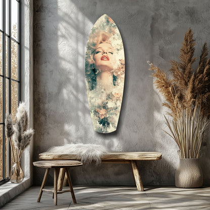 Oval glass wall art with portrait of woman and floral overlay displayed above wooden bench in minimalist room setting.
