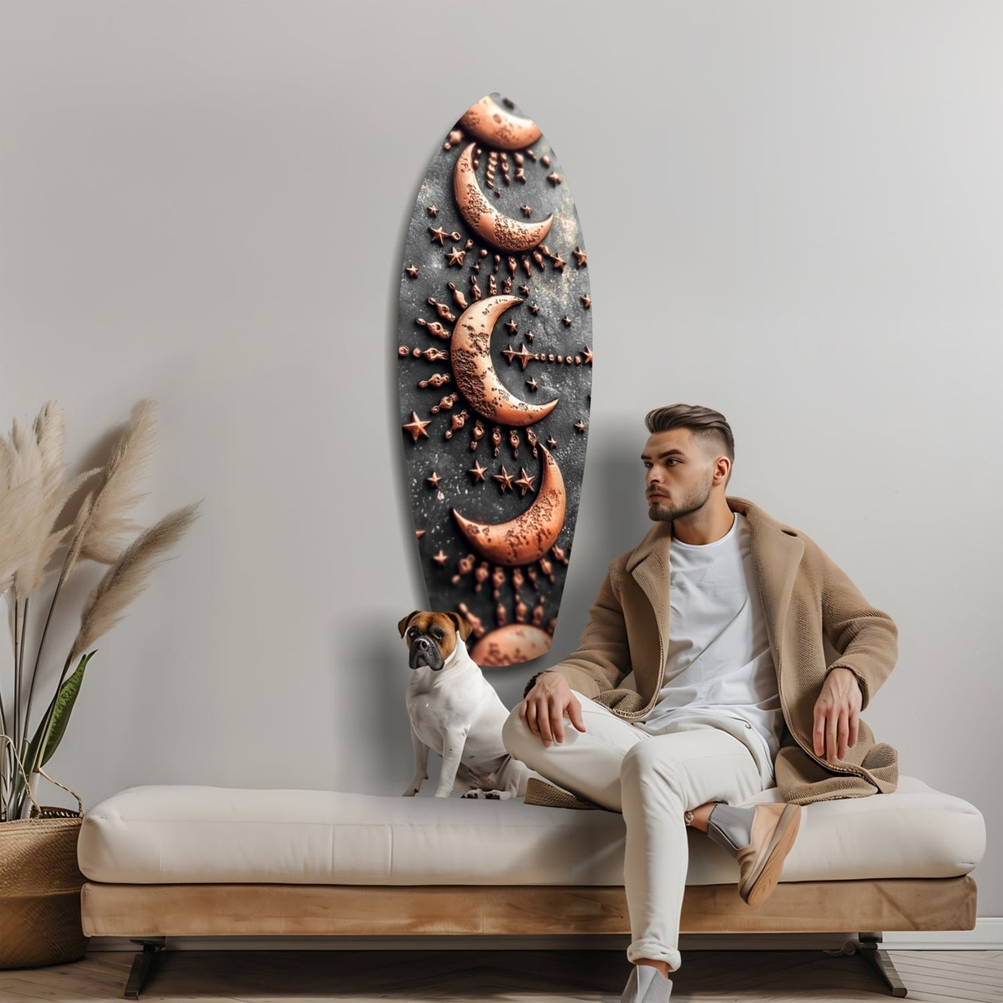 Man and dog sitting on bench beside oval dark glass wall art with copper moon and star relief designs.