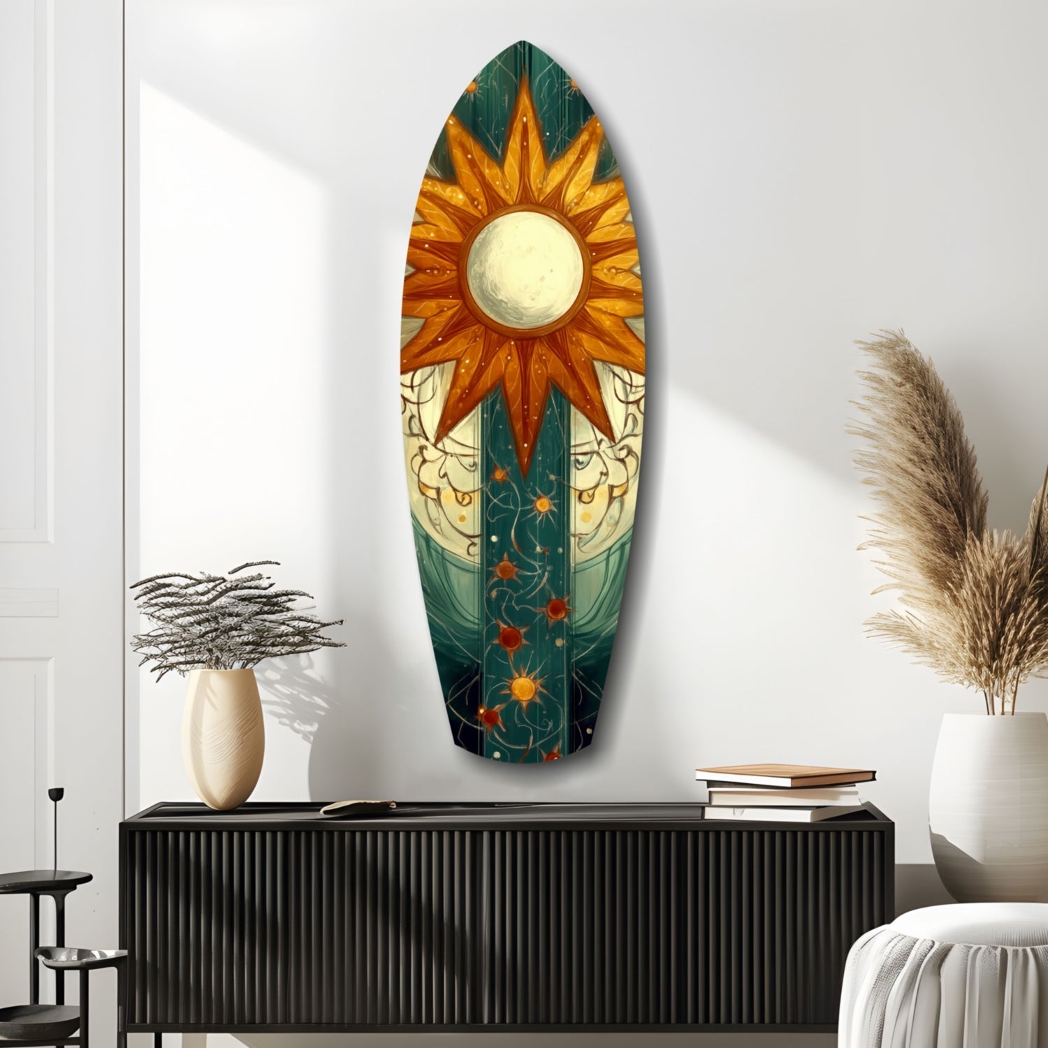 Oval glass wall art featuring a golden sun with orange rays above celestial and botanical imagery on a dark teal background, displayed above a black ribbed console.