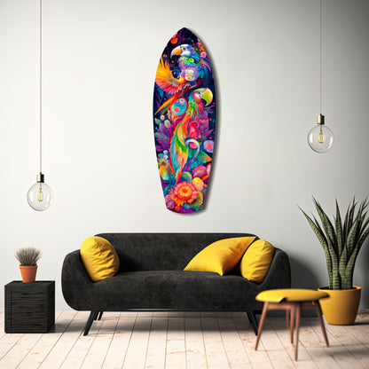 Colorful glass wall art depicting tropical birds and flowers displayed above a black sofa in a modern living room interior.