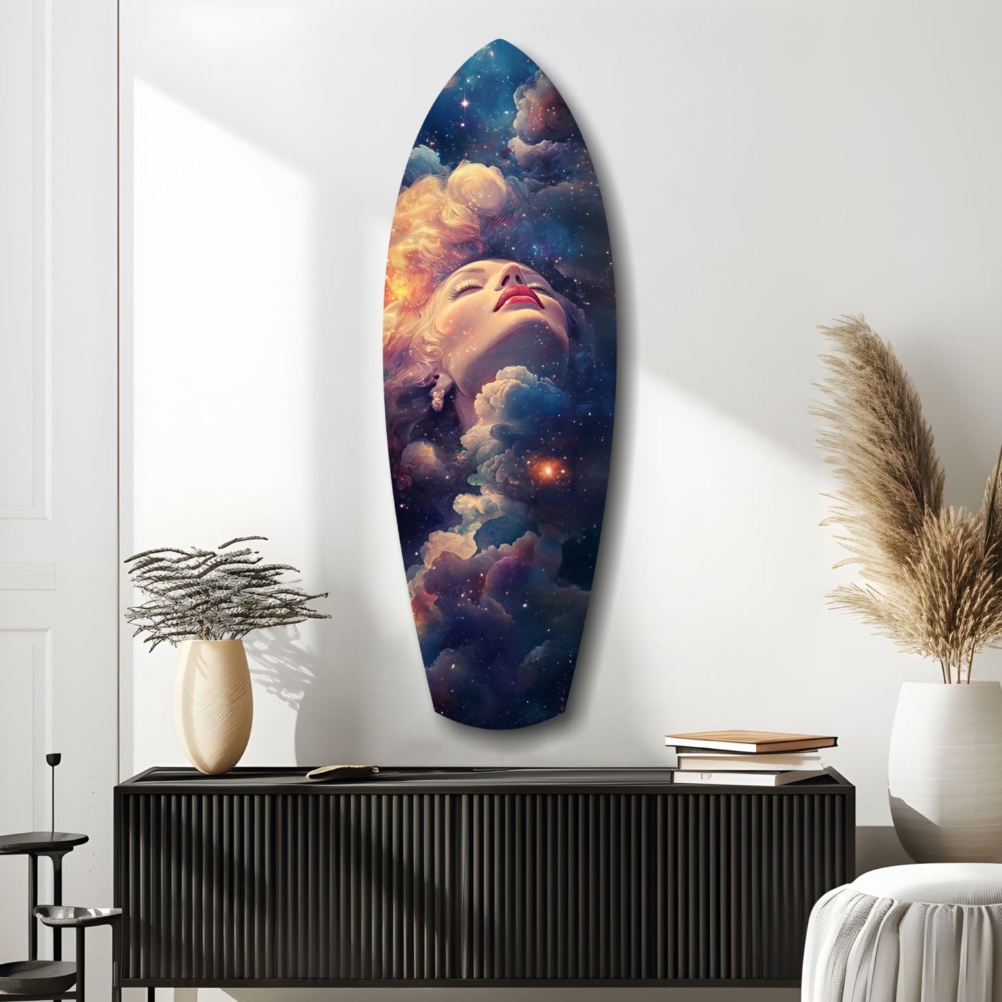 Oval glass wall art mounted above black credenza displays celestial-themed portrait with golden clouds, stars, and dreaming face against deep blue background.