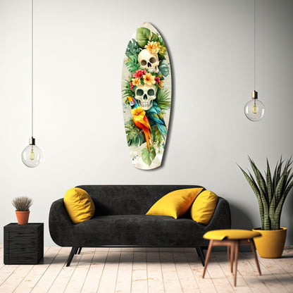Tropical Mystique glass wall art displayed above black sofa with yellow pillows in modern living room setting.