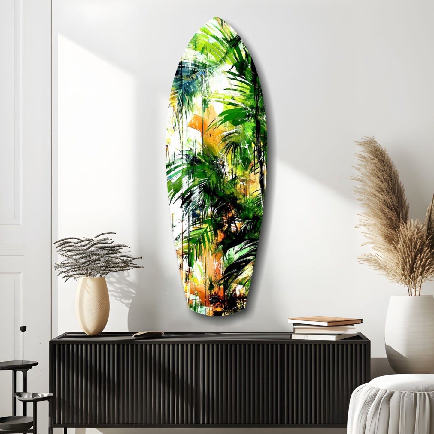 Oval tropical forest glass wall art depicting layered green palm fronds and yellow flowers displayed above black cabinet in modern interior.