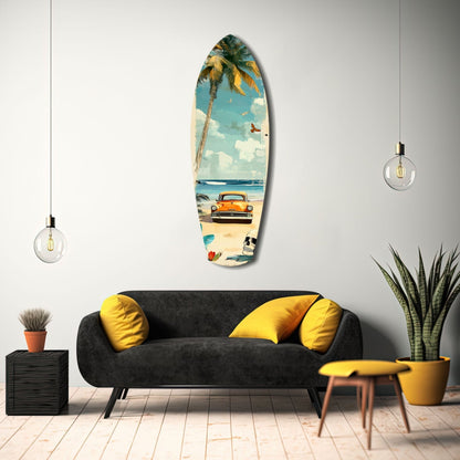 Surfboard-shaped glass wall art displaying vintage beach scene with orange car, palm tree, and ocean, hanging above black sofa with yellow pillows in modern living room.