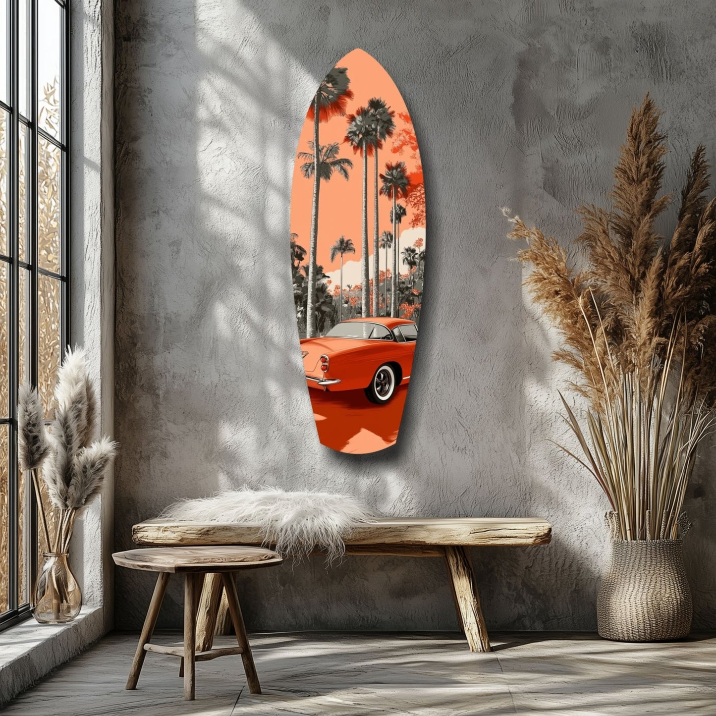 Oval glass wall art featuring a red vintage car beneath palm trees against an orange sky, displayed above a wooden bench in a minimalist room.