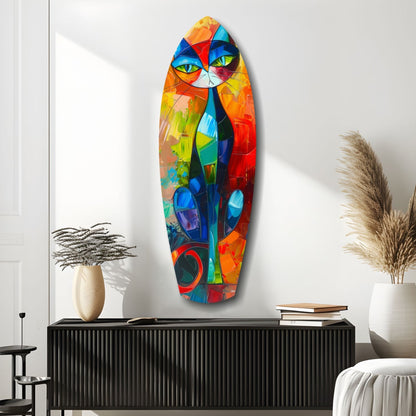 Colorful cubist cat glass wall art in vibrant geometric patterns displayed above black credenza in modern minimalist interior.