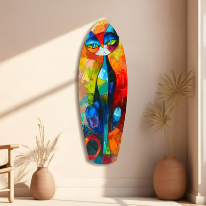 Colorful cubist cat glass wall art mounted vertically between two terracotta vases with dried grasses in minimalist beige interior.