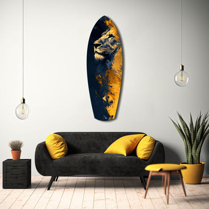 Lion Pride V1 glass wall art featuring a lion's profile in gold and navy blue, displayed above a black sofa with yellow pillows in a modern living room setting.