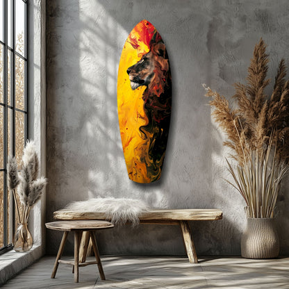 Lion Pride V3 glass wall art displayed on gray textured wall above wooden bench, featuring red and yellow flames with lion profile.