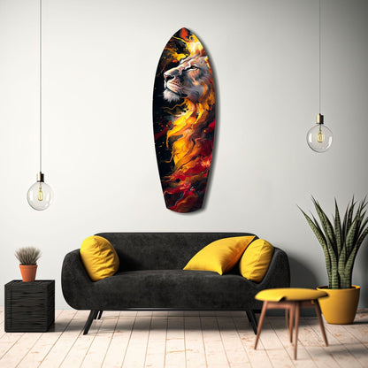 Lion Pride V4 glass wall art displaying a lion's head surrounded by golden and red flames, mounted above a black sofa in a modern living room interior.