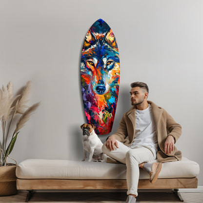 Man in beige cardigan and white pants sitting on bench with boxer dog, colorful wolf art glass panel mounted on wall behind them.
