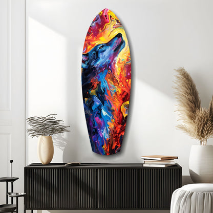 Colorful glass surfboard art with swirling blue, red, yellow, and orange patterns displayed on white wall above black dresser.