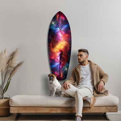 Man and dog sit on cream sofa beside oval galaxy glass wall art displaying vibrant nebula colors in red, purple, and blue tones.