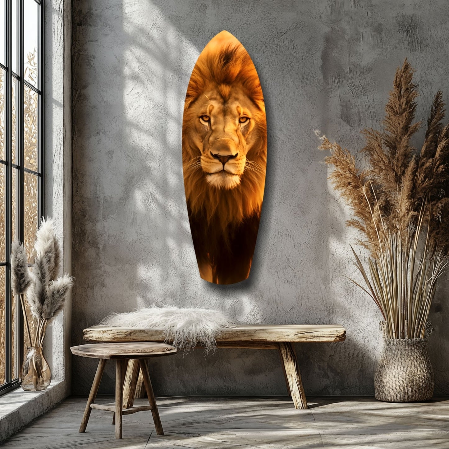 Lion head glass wall art in warm golden tones displayed on gray textured wall beside wooden bench and dried pampas grass.