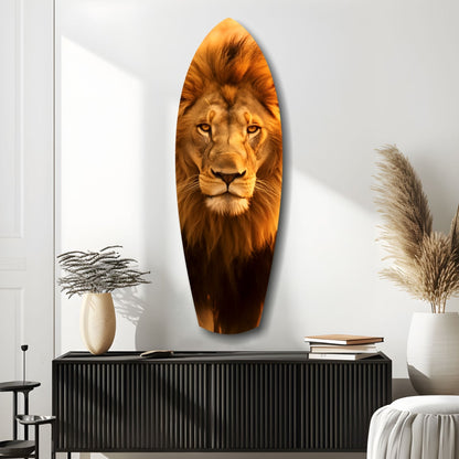 Oval glass wall art featuring a majestic lion's head portrait in warm golden and brown tones, displayed above a black ribbed console table in a modern interior setting.