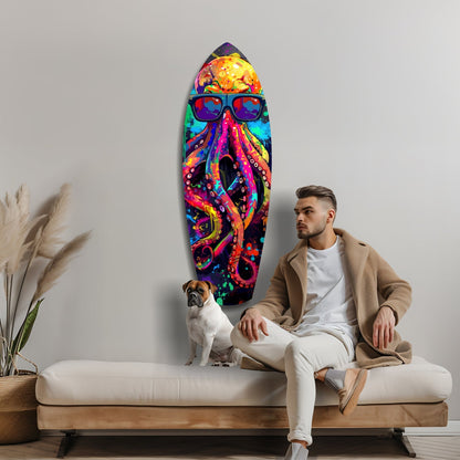 Man with dog sitting on bench beneath vibrant multicolored glass octopus wall art wearing sunglasses.