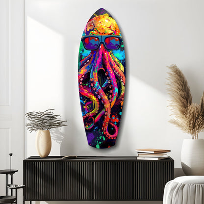 Colorful glass wall art featuring a vibrant octopus wearing sunglasses, displayed above a black console table in a modern interior setting.