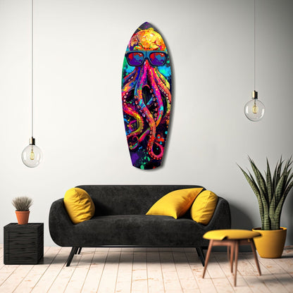 Colorful Mr Octopus glass wall art featuring vibrant rainbow octopus with sunglasses displayed above black sofa in modern living room setting.