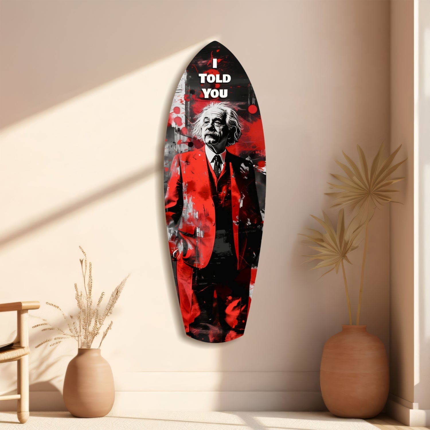 Red and black glass wall art featuring Einstein portrait with "I TOLD YOU" text, displayed on beige wall beside decorative vases.