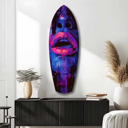 Neon pink lips with blue urban cityscape displayed on oval glass wall art mounted above black credenza in modern interior.