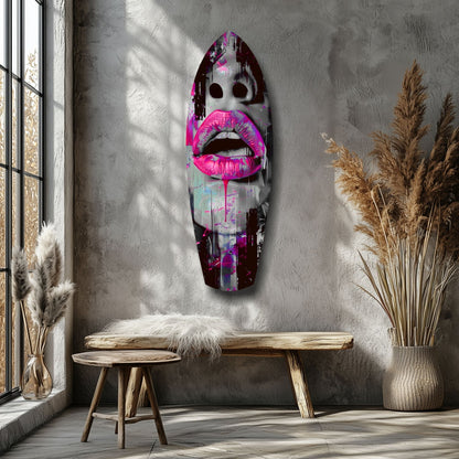 Vibrant pop art glass wall sculpture featuring bold pink lips and dark eyes displayed in a minimalist interior with wooden furniture and dried pampas grass.