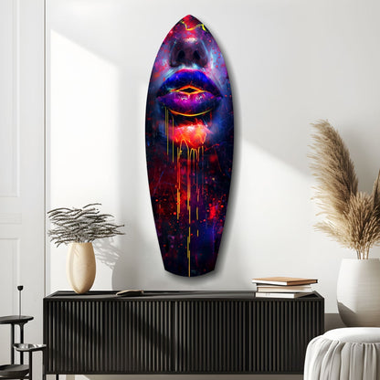 Vibrant neon lips glass art mounted on white wall above black console cabinet with decorative vases and books.