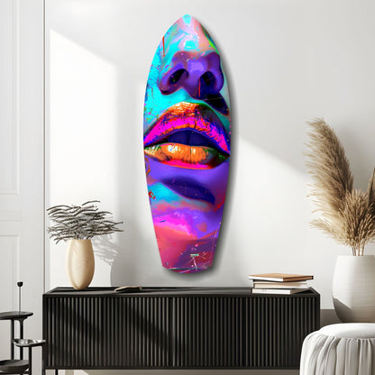 Vibrant neon-colored glass wall art featuring abstract lips in cyan, magenta, orange, and purple hues mounted above a black cabinet in a minimalist interior.
