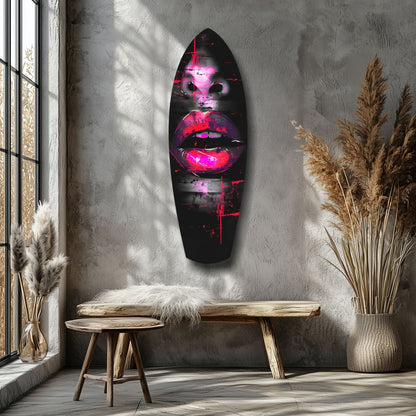 Neon pink and red illuminated lips glass wall art hung above wooden bench in minimalist interior with dried pampas grass.