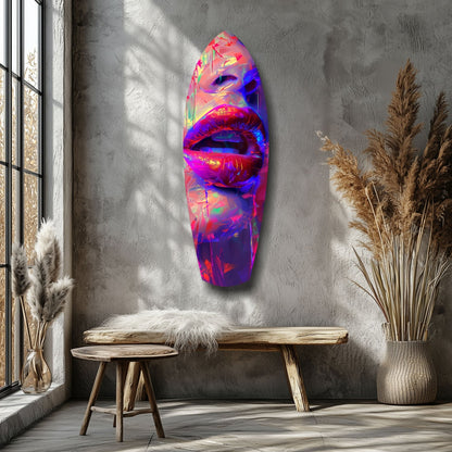 Vibrant neon glass wall art featuring colorful lips in pink, blue, and yellow tones mounted on concrete wall beside wooden bench and dried pampas grass.