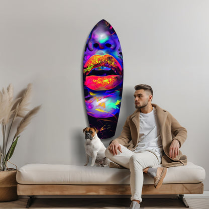 Man and dog sitting on modern couch beside vibrant neon glass wall art featuring colorful lips design.