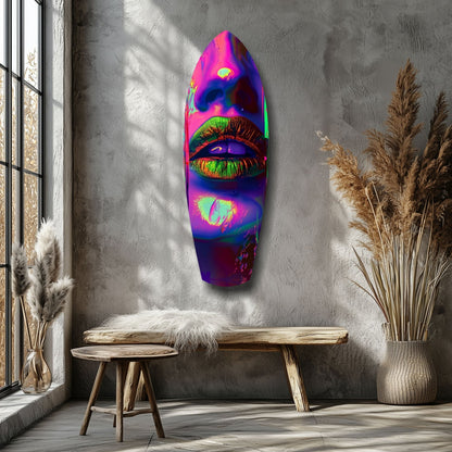 Neon lips glass wall art displayed on gray concrete wall between wooden bench and pampas grass decor.