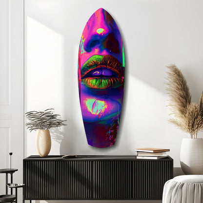 Neon-colored glass wall art featuring vibrant pink, purple, and lime lips displayed above a black cabinet in a modern interior setting.