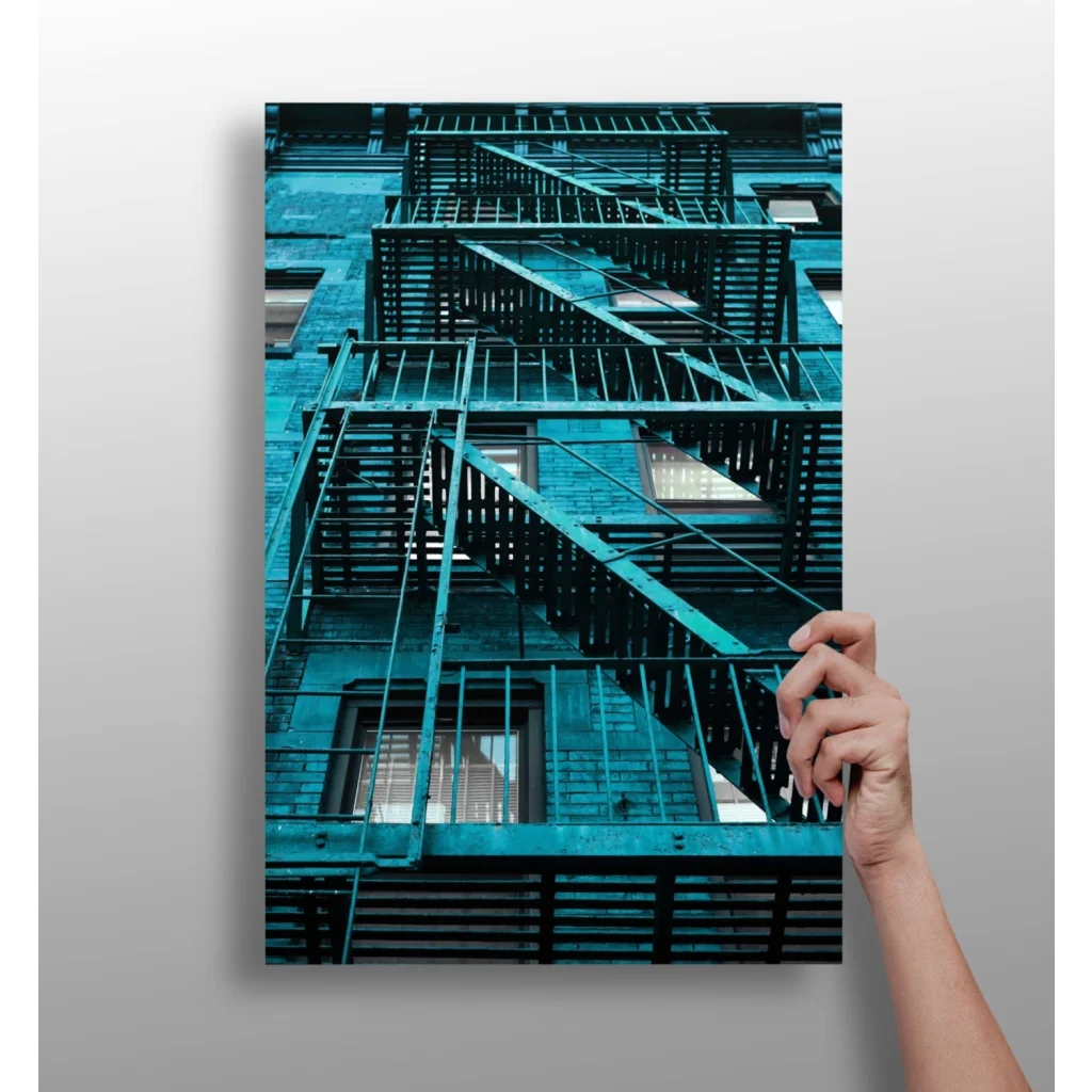 Teal fire escape staircase in insigne aluminum prints, a decorative solution