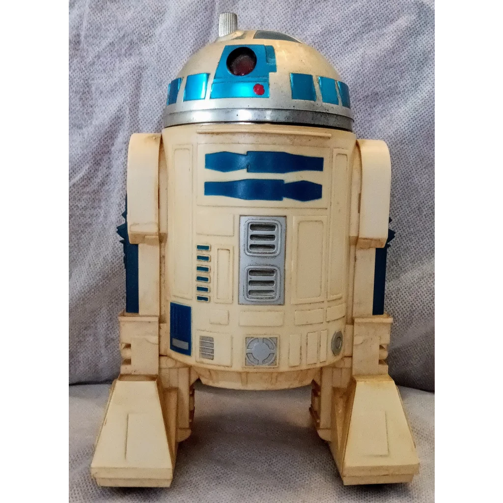 Star Wars remote R2D2 toy robot in beige, blue, and silver