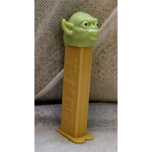 Vintage Star Wars Yoda Pez dispenser with green body and yellow base
