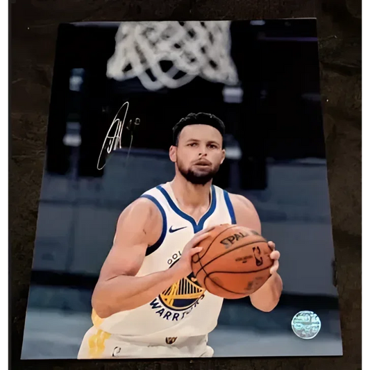 Stephen Curry autographed 8x10 photo in Warriors uniform holding basketball