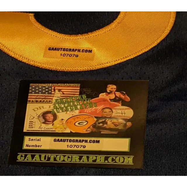 Stephen Curry autographed jersey with authentication sticker and tag on blue jersey