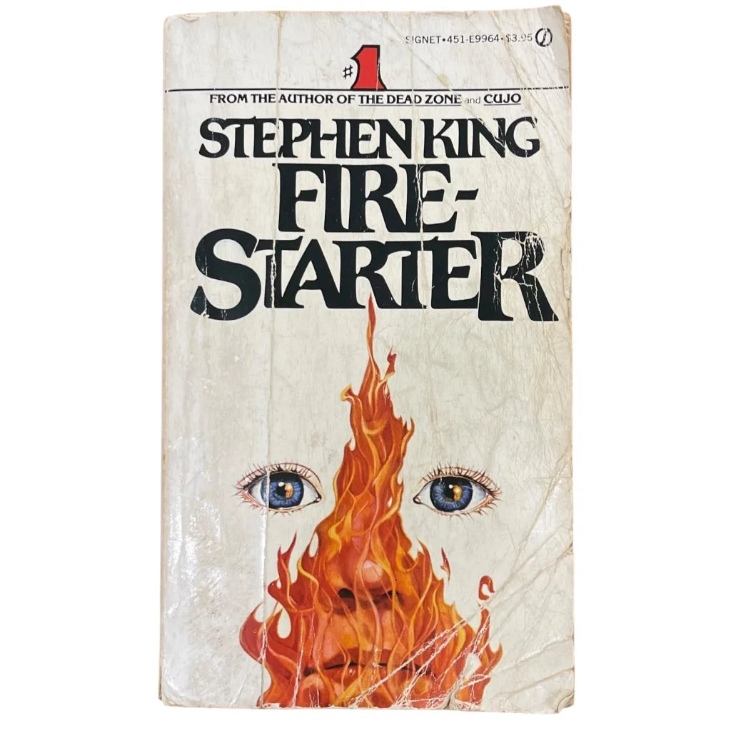 Stephen King autographed Firestarter book cover with eyes and flames