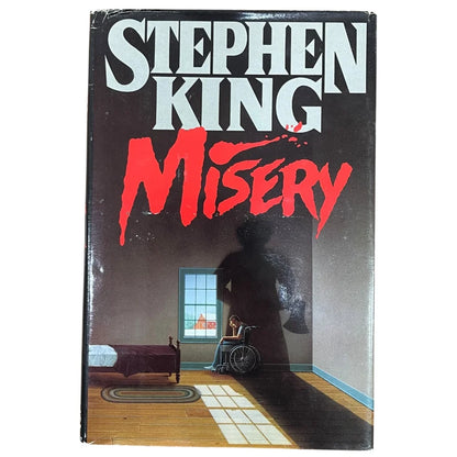 Stephen King autographed Misery first edition cover with shadowy wheelchair figure
