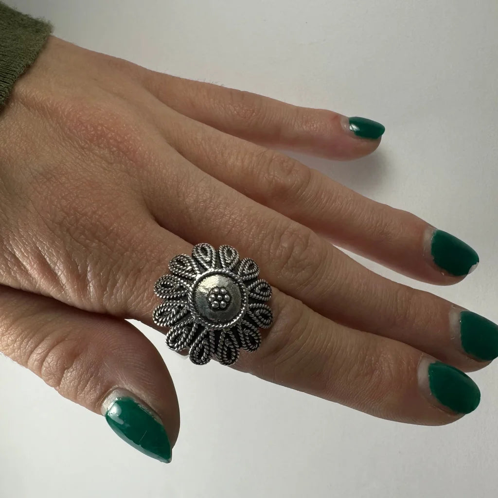 Sterling silver flower ring with twisted filigree petals