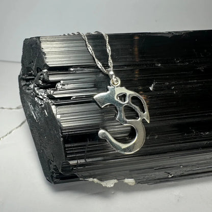 Sterling silver ohm pendant with twisted rope chain and cut-out design