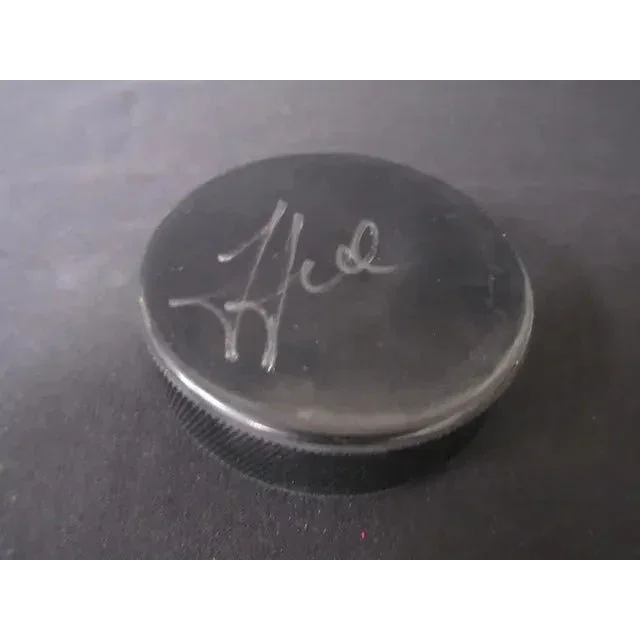 Black hockey puck with silver signature from Steven Stamkos signed hockey collection