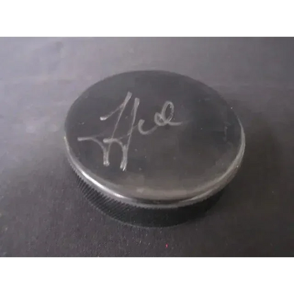 Black hockey puck with silver signature from Steven Stamkos signed hockey collection