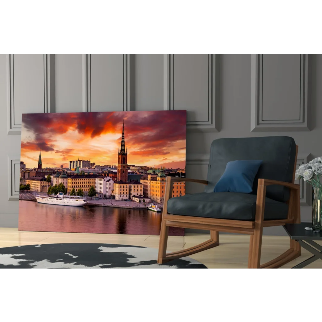 Vibrant sunset glass wall art print of cityscape on wall