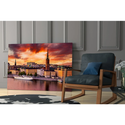 Vibrant sunset glass wall art print of cityscape on wall
