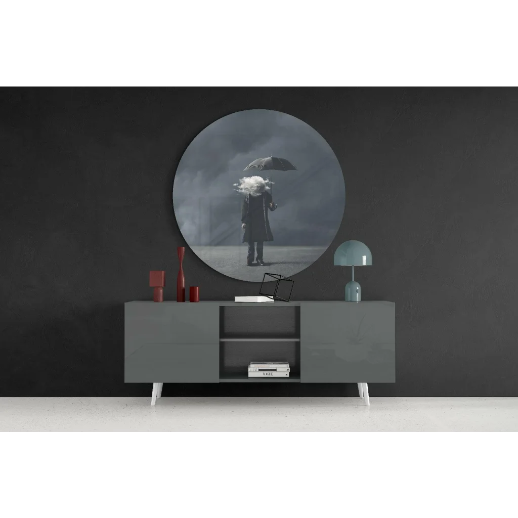 Stunning tempered glass art of figure with umbrella in moody clouds