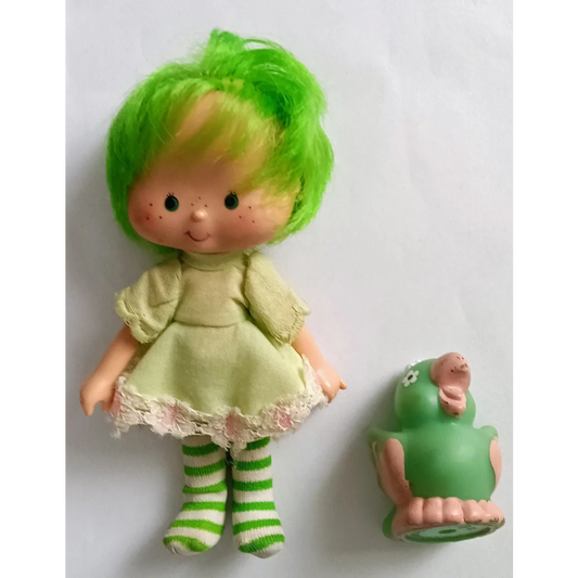 Cute green Strawberry Shortcake doll in lime chiffon dress with frog pal