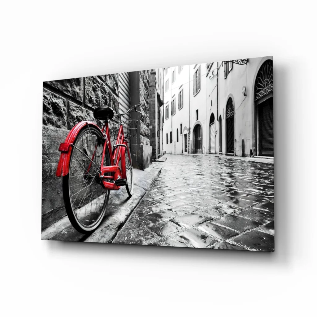 Red vintage bicycle on wet cobblestone in glass wall art print