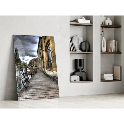 Dramatic cobblestone street glass wall art with vintage bicycle