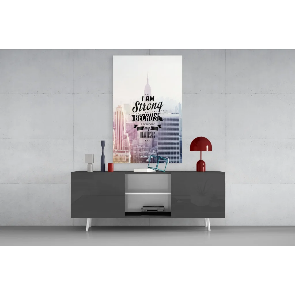 Modern gray console table with white legs and glass wall art prints